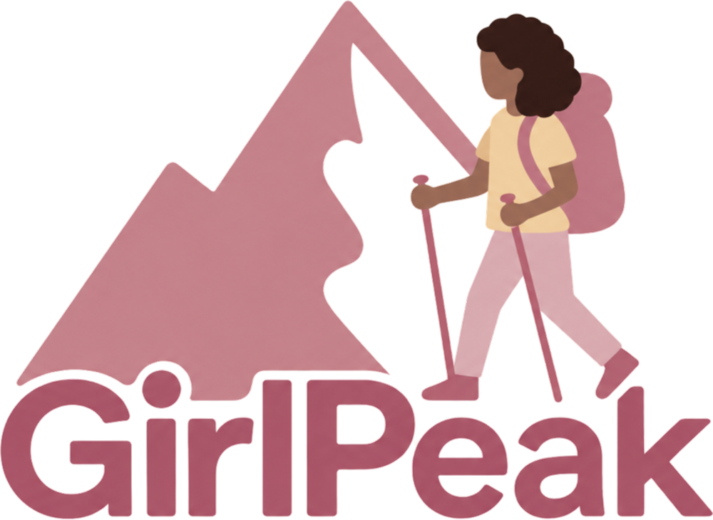 GirlPeak: a hiker with a backpack and trekking poles in front of a mountain